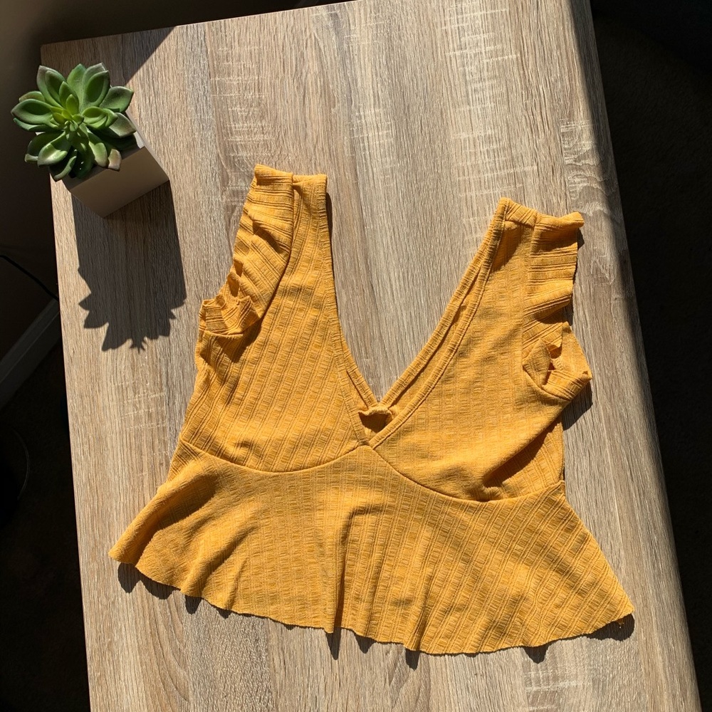Yellow frilly shoulder crop tank